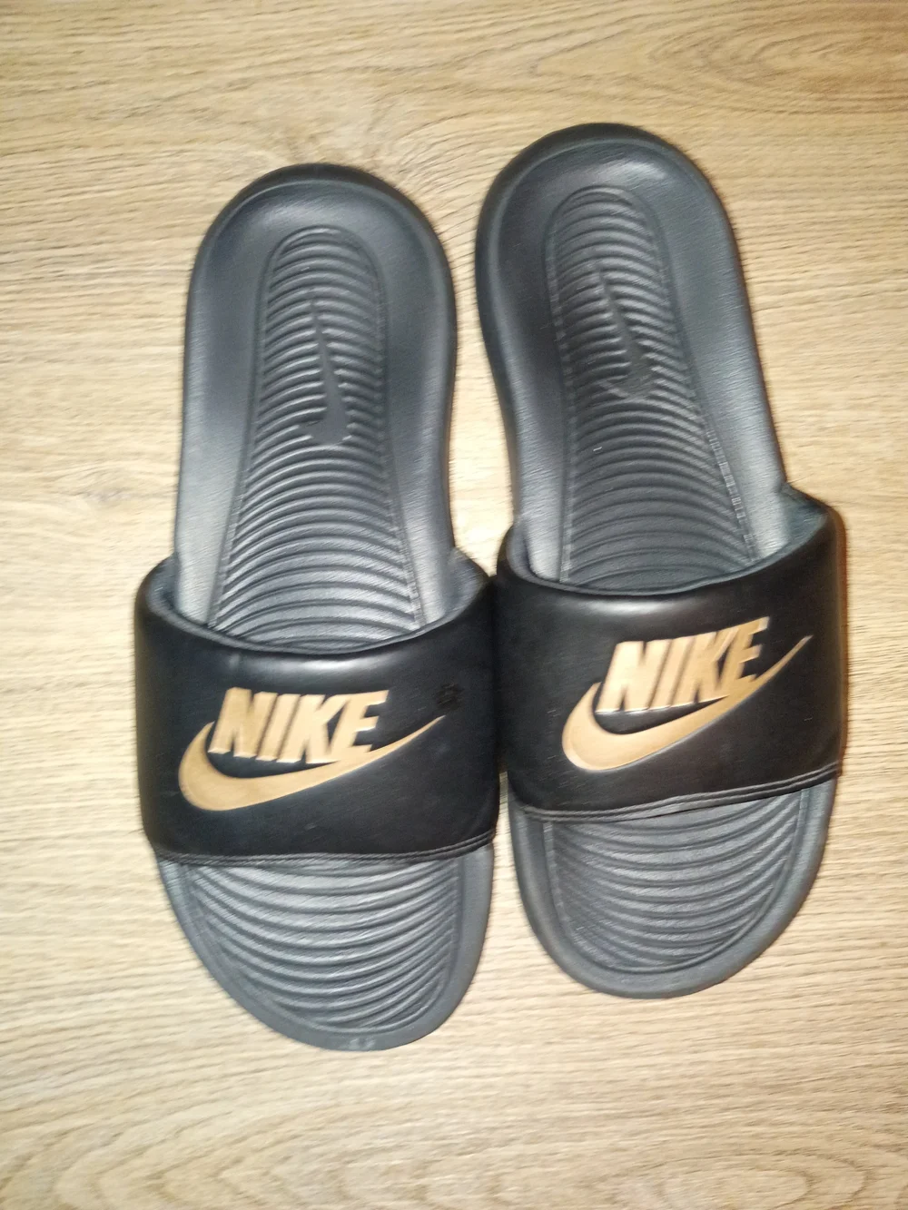 Nike Men's Black Slide Sandals with Gold Swoosh